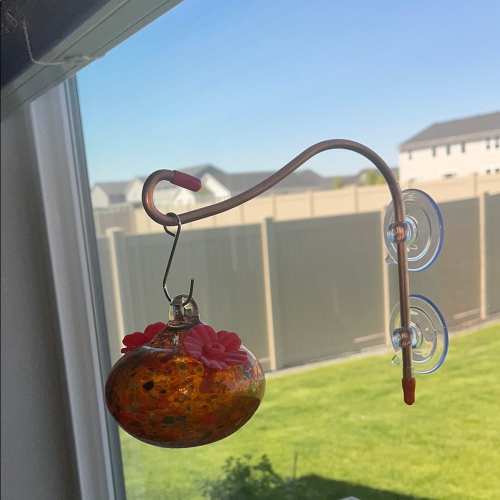 Orange and Red Bird Feeder with Ornate Design